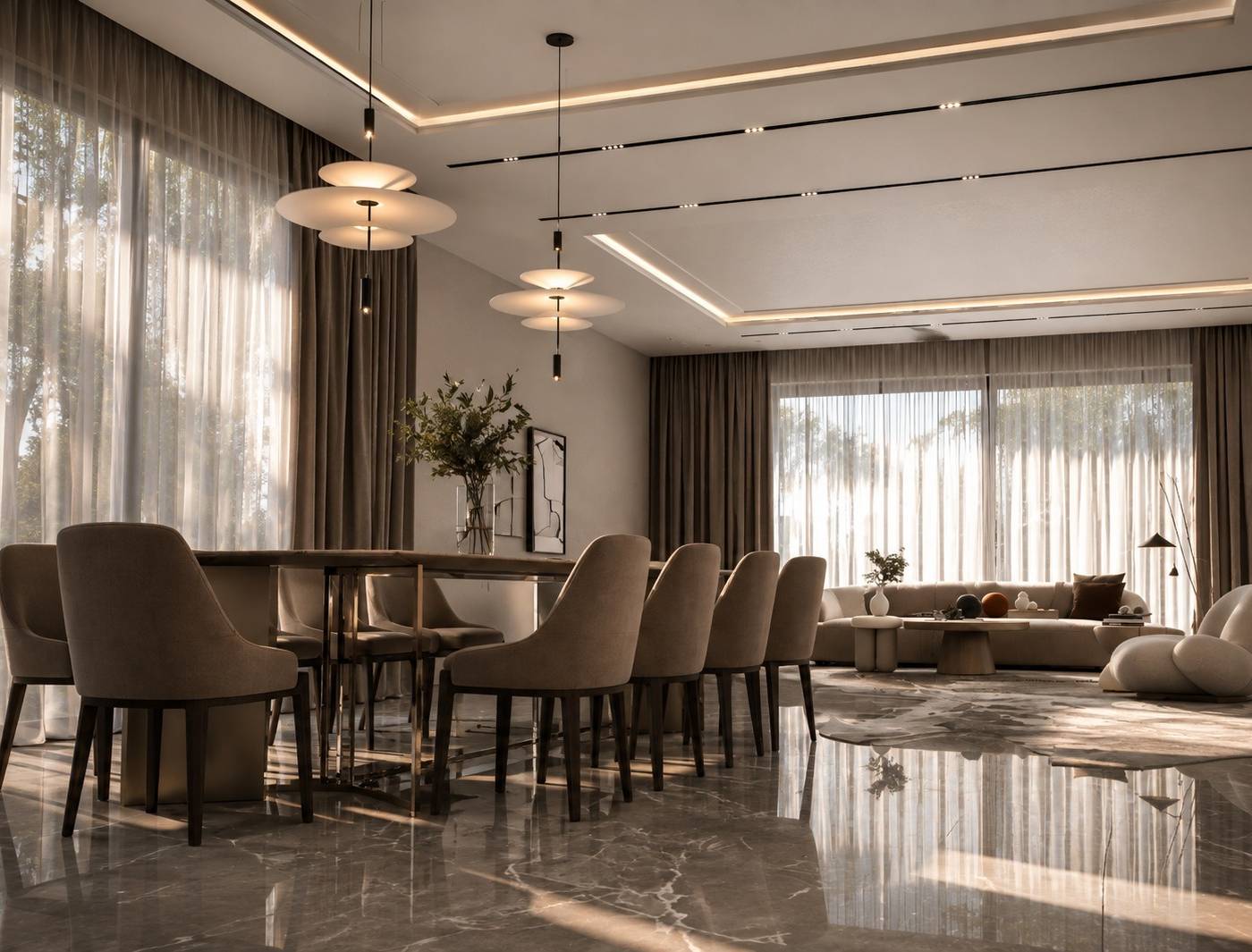 Open plan living and dining area with tiered pendant lights and marble floors in a Dubai villa renovation by Chadi Baaklini
