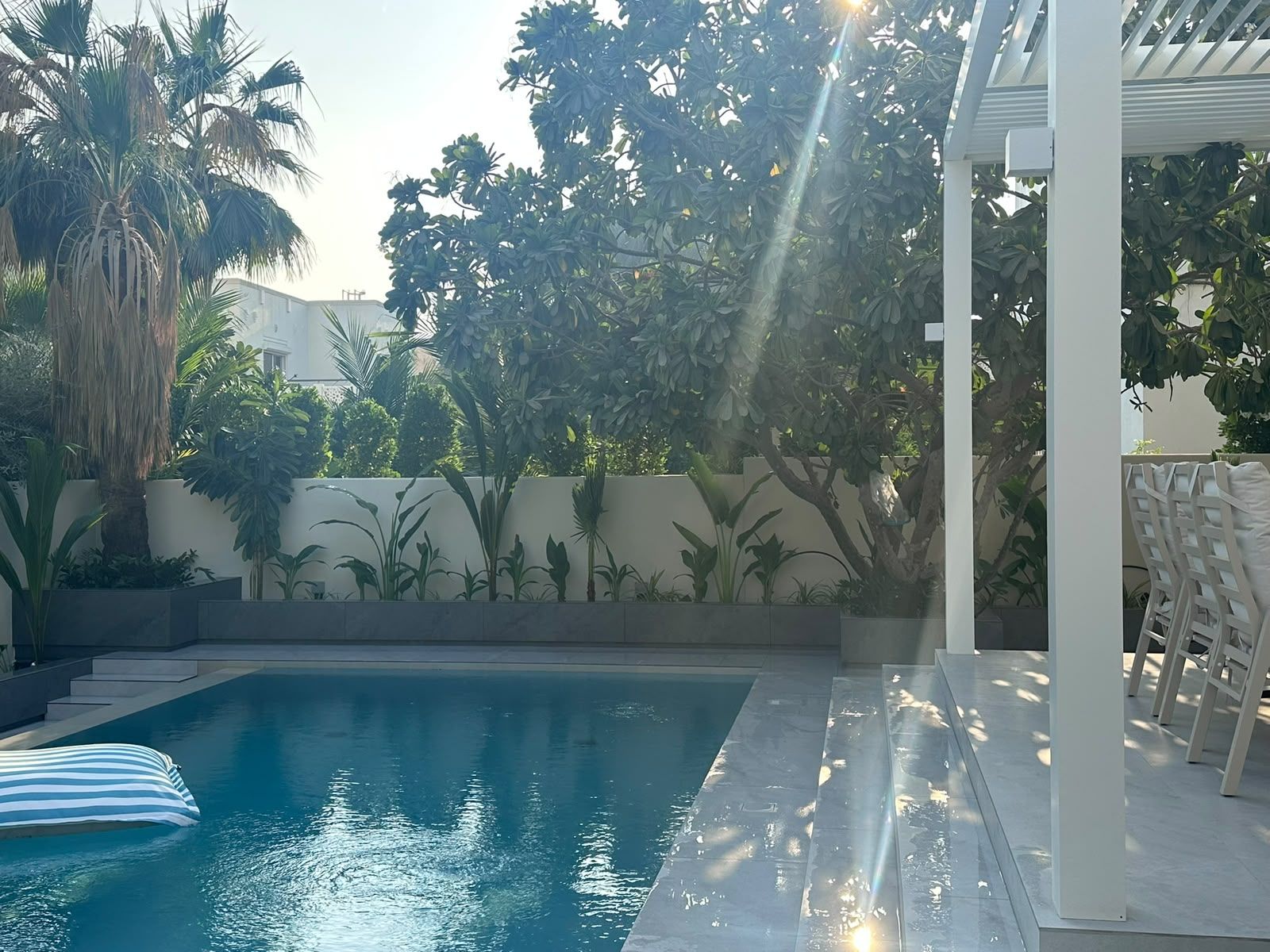 Clear pool framed by lush tropical planting