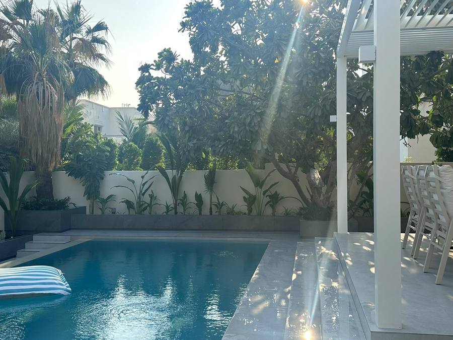 Clear pool framed by lush tropical planting