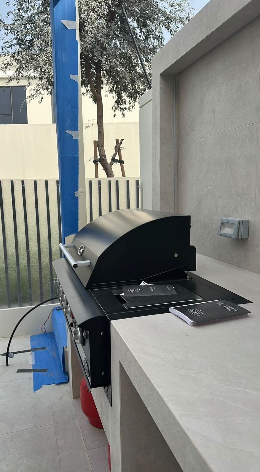 Built-in BBQ grill on a stone countertop