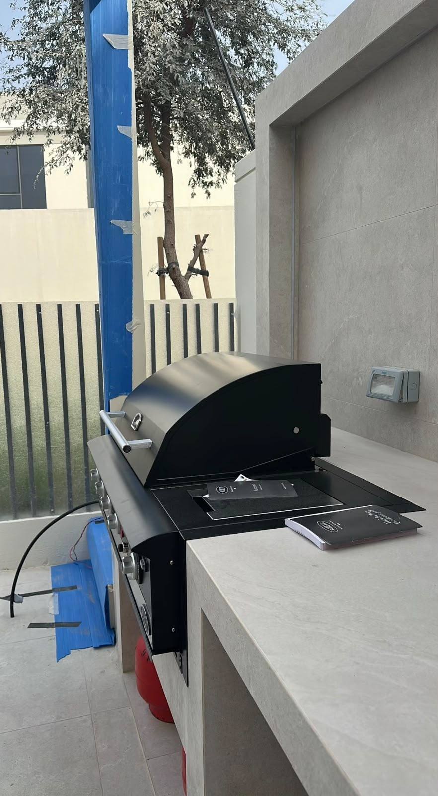 Built-in BBQ grill on a stone countertop